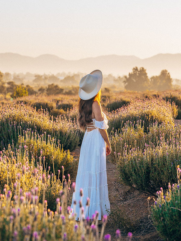 Cocopina Belle maxi Dress in White - Women wearing dress in lavender field