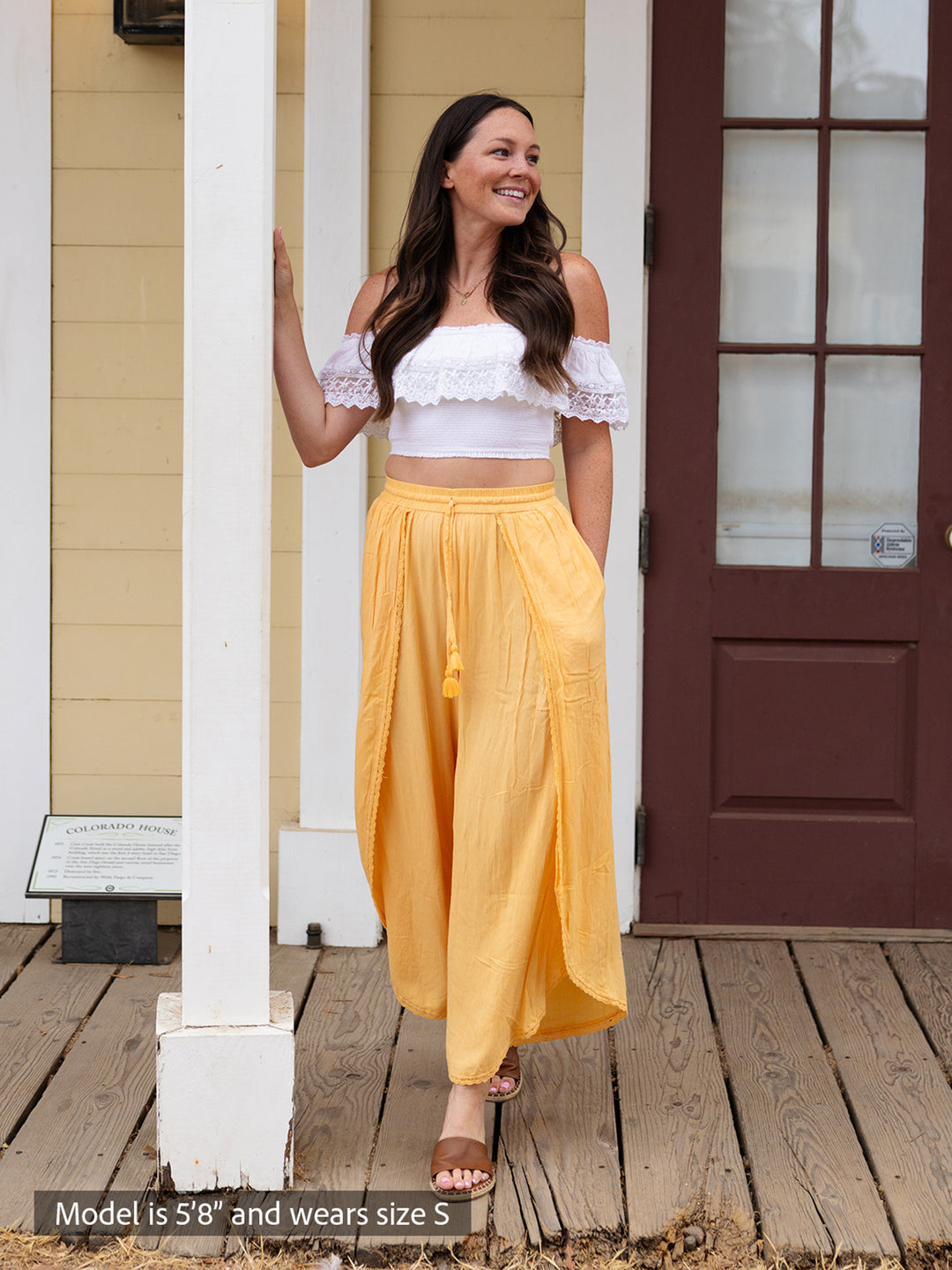 White smocked off-shoulder crop top with lace trim and boho-chic airy open-side wide-leg pants