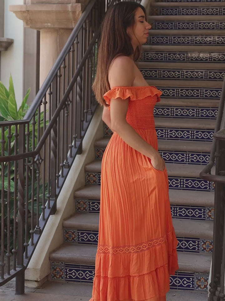 orange boho maxi dress with smocked bodice, lace trim, tiered skirt and side pockets